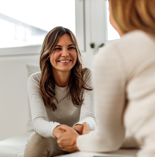 woman smiling with therapist